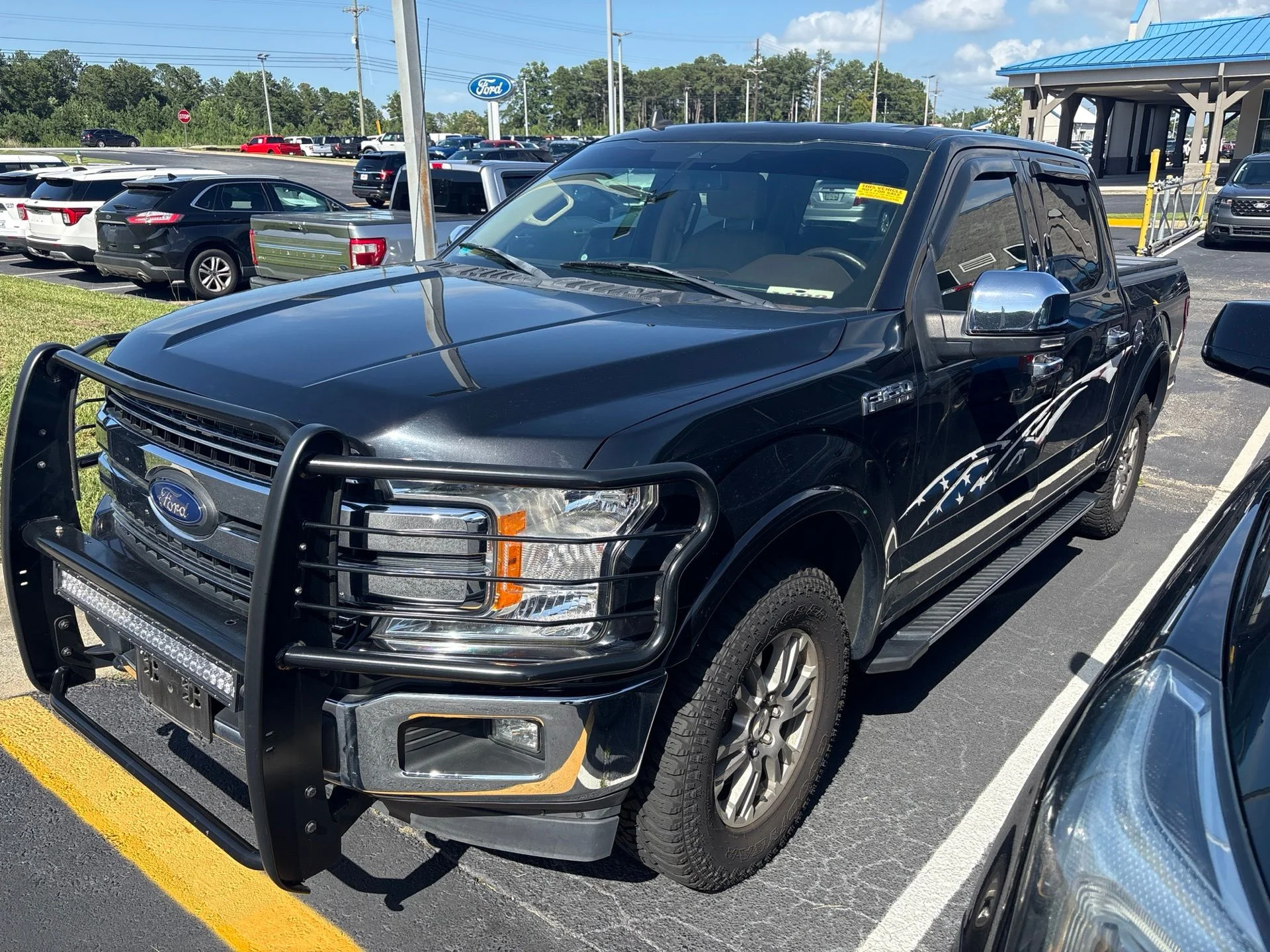 Used 2019 Black Metallic Ford Lariat image 1