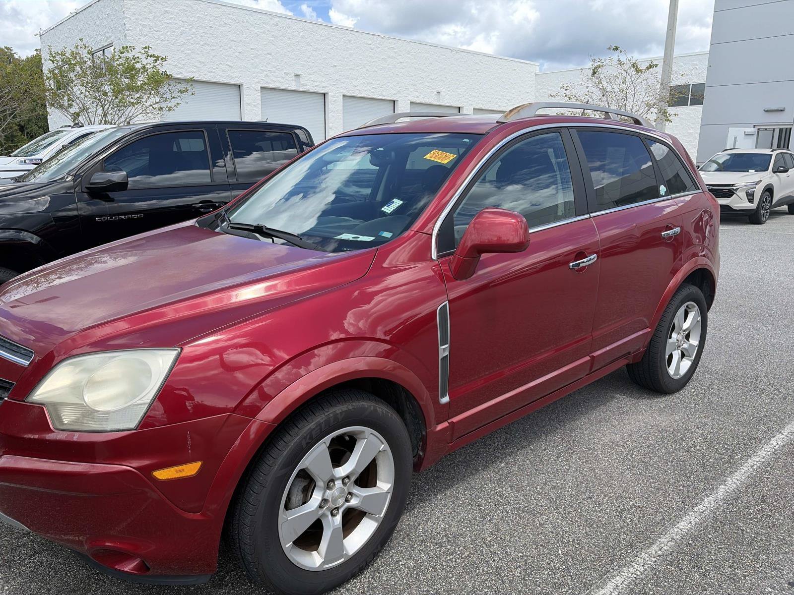 Used 2014 Crystal Red Tintcoat Chevrolet LTZ image 1