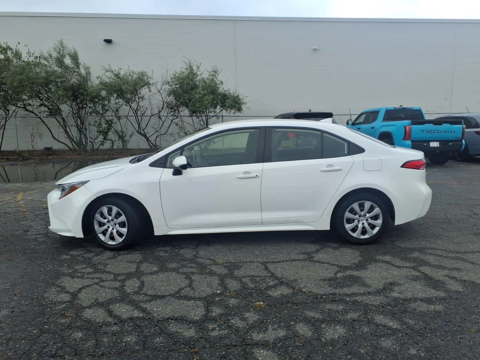 Used 2021 Super White Toyota LE image 8
