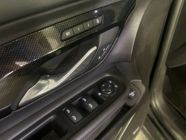 Used 2024 Ebony Twilight Metallic GMC AT4 image 13