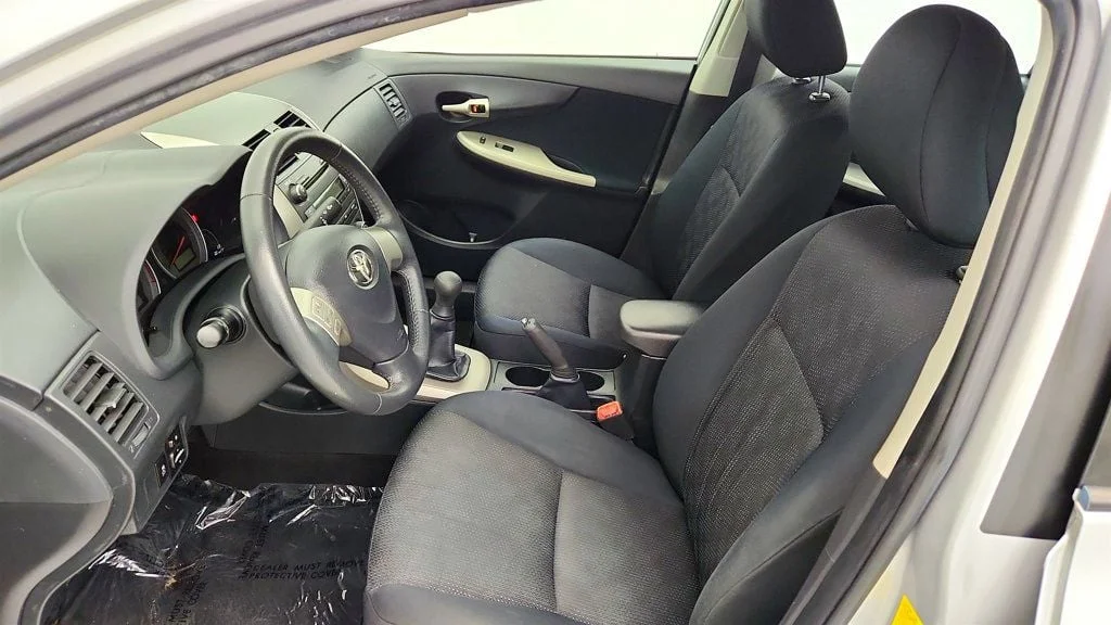 Used 2010 Classic Silver Metallic Toyota 4dr Sedan Manual S w/ Power Moonroof & 16