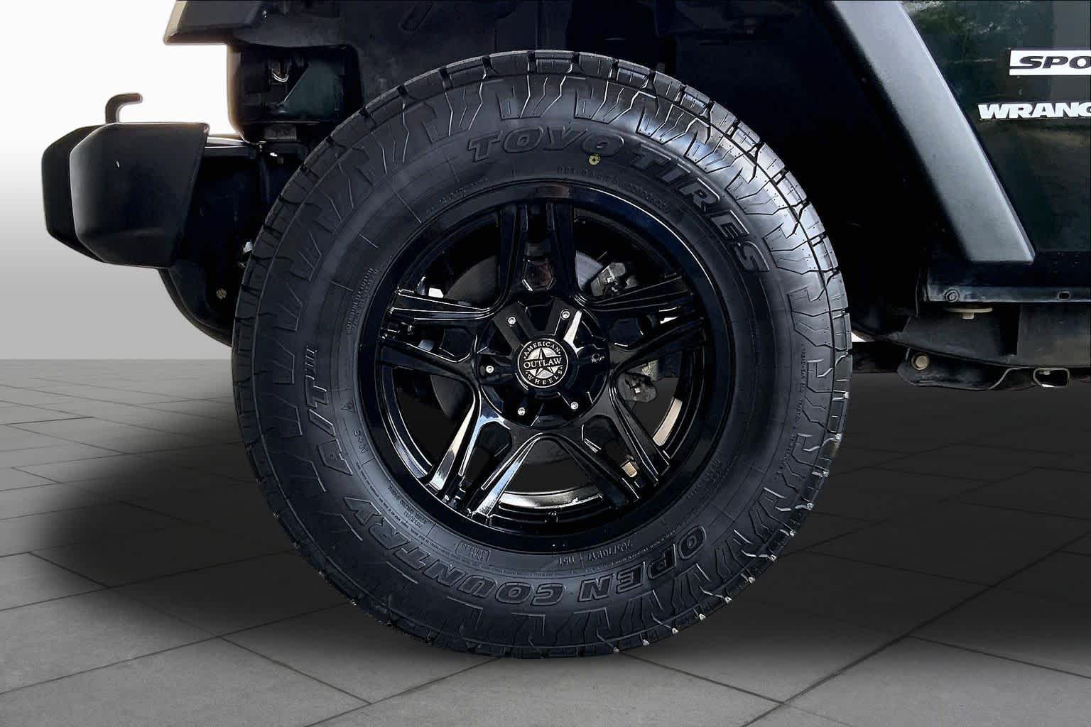 Used 2012 Black Forest Green Pearl Jeep Sport image 10
