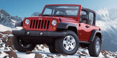 Used 2007 Yellow Jeep X image 1